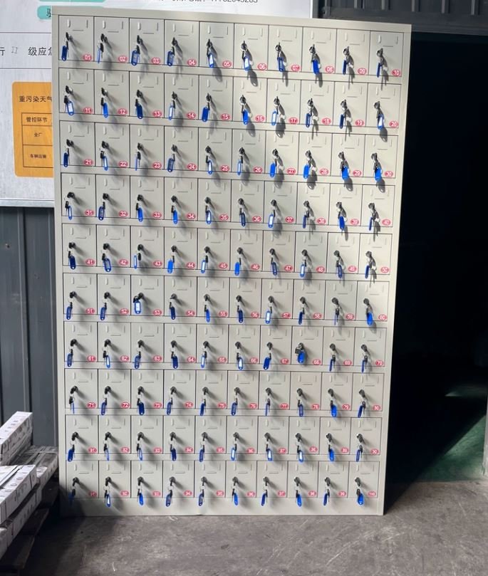 32-slot device charging cabinet with key locks and ventilation slots for a classroom