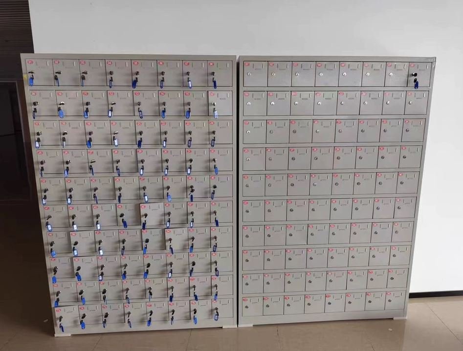 Device charging cabinet with numbered slots and key lock system for school use