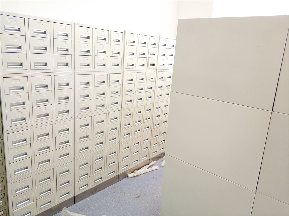 Pathology specimen storage room with rows of wax block and slide cabinets