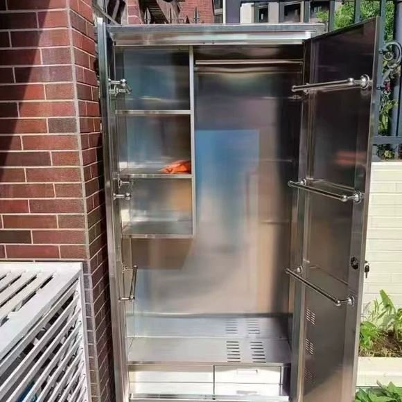 Stainless steel cleaning cabinet installed outdoors showing door and ventilation