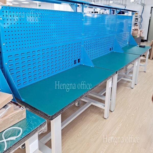 Heavy-duty steel workbench with adjustable feet and reinforced frame